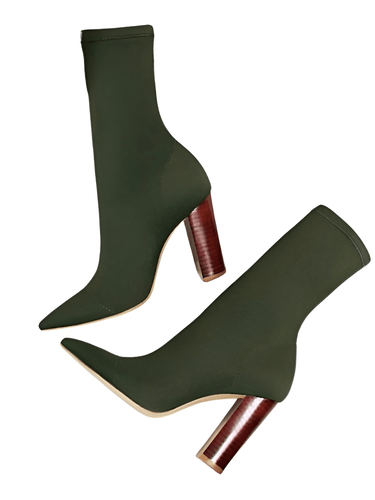 Olive green high-heeled ankle sock boots with brown wooden soles on a white background